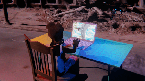 Desktop #13: The Military Brat in the French Wood Chair With a Drone and a Gardens Monitor on a Green FELT Zine Table in Conflict